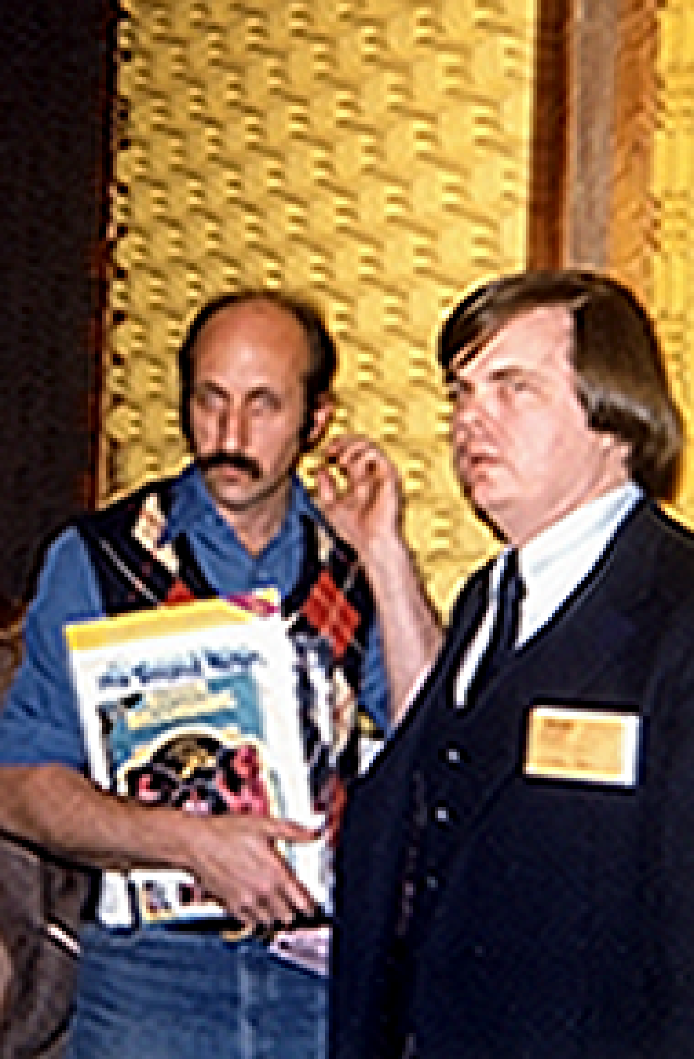 Paul (Noel Stookey) of Peter, Paul, and Mary listens to the quiet at our booth at the NY AES in 1979.